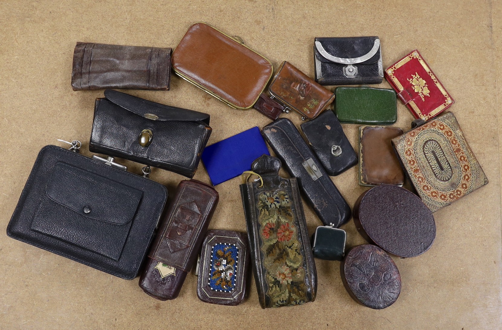 A large collection of unusual Morocco leather purses, bags and containers, some embossed and some with petite point embroidery, mostly 19th century.